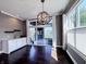 An open living room boasts hardwood floors, a fireplace and bright natural light from the sliding glass doors at 10297 Anees Ln, Fishers, IN 46040