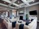 Elegant living room with stone fireplace and ample seating arrangement at 10297 Anees Ln, Fishers, IN 46040