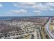 Aerial view of a residential neighborhood with easy access to the highway and nearby woods and ponds at 11005 Long Lake Ln, Fishers, IN 46037