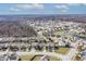 A panoramic view showcasing a residential neighborhood nestled near a pond, offering a serene living environment at 11005 Long Lake Ln, Fishers, IN 46037