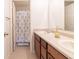 Nicely appointed bathroom with dual vanity, shower, and decorative accents at 11005 Long Lake Ln, Fishers, IN 46037