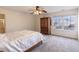 Comfortable bedroom with ceiling fan, wardrobe, queen bed, and window views at 11005 Long Lake Ln, Fishers, IN 46037
