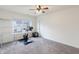 A carpeted spare bedroom includes a weight-training bicycle and a mini refrigerator at 11005 Long Lake Ln, Fishers, IN 46037