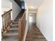 Inviting foyer with hardwood floors and a staircase leading to the upper level at 11005 Long Lake Ln, Fishers, IN 46037