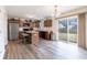 Cozy kitchen with stainless steel appliances, a center island, and wood cabinets at 11005 Long Lake Ln, Fishers, IN 46037