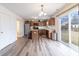 Bright kitchen featuring stainless steel appliances, a center island, and hardwood floors at 11005 Long Lake Ln, Fishers, IN 46037