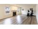Spacious living room with a fireplace, hardwood floors, and plenty of natural light at 11005 Long Lake Ln, Fishers, IN 46037