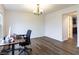 A clean, naturally lit room features a computer desk and chair, perfect for a home office setup at 11005 Long Lake Ln, Fishers, IN 46037
