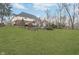 Expansive backyard with a well-manicured lawn and mature trees offering privacy at 11727 Windpointe Pass, Carmel, IN 46033