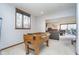 Basement recreation area with a classic foosball table and comfortable seating at 11727 Windpointe Pass, Carmel, IN 46033