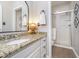 Well-lit bathroom with granite countertops, a sink, and a glass-enclosed shower at 11727 Windpointe Pass, Carmel, IN 46033
