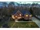 Stunning two-story brick home with lush landscaping and a welcoming front entrance at 11727 Windpointe Pass, Carmel, IN 46033