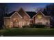Charming two-story brick home with a well-manicured lawn and inviting curb appeal at 11727 Windpointe Pass, Carmel, IN 46033