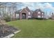 Stunning brick home with a manicured lawn and elegant architectural details for curb appeal at 11727 Windpointe Pass, Carmel, IN 46033