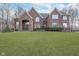 Stately brick home with manicured lawn and mature landscaping offering curb appeal at 11727 Windpointe Pass, Carmel, IN 46033