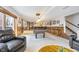 Basement game room with a pool table, bar area, carpeted floors and wainscotting trim at 11727 Windpointe Pass, Carmel, IN 46033