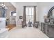 Bright living room with neutral carpet, a large window, and comfortable seating area at 11727 Windpointe Pass, Carmel, IN 46033