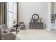 Bright living room with neutral carpet, a large window, and comfortable seating area at 11727 Windpointe Pass, Carmel, IN 46033