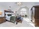 Sun-filled main bedroom featuring a king-size bed, seating area, and plenty of natural light at 11727 Windpointe Pass, Carmel, IN 46033