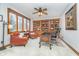 Charming home office with hardwood built-ins, two armchairs, and a ceiling fan at 11727 Windpointe Pass, Carmel, IN 46033
