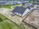 An aerial view of the home's backyard features new construction and the surrounding neighborhood at 1202 Brightwood Cir, Greenfield, IN 46140