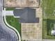 An aerial view of the home's roof, driveway, sidewalk, and surrounding green space at 1202 Brightwood Cir, Greenfield, IN 46140