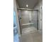 Bright tiled bathroom with a glass-enclosed shower and a built-in bench at 1202 Brightwood Cir, Greenfield, IN 46140