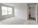 Bright bedroom with soft carpet, large windows, closet and doors providing a comfortable living space at 1202 Brightwood Cir, Greenfield, IN 46140