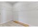 Walk-in closet featuring wire shelving, neutral carpeting, and ample space for storage and organization at 1202 Brightwood Cir, Greenfield, IN 46140