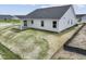 An elevated view of the home's exterior with white siding, a covered patio, and a dark roof at 1202 Brightwood Cir, Greenfield, IN 46140