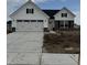 New construction featuring white siding, black shutters, stone accents, and an attached two-car garage at 1202 Brightwood Cir, Greenfield, IN 46140