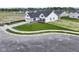 A high angle view of a home featuring manicured front lawn, a two-car garage and landscaping at 1202 Brightwood Cir, Greenfield, IN 46140