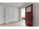 Inviting foyer featuring neutral paint, light wood floors and a glimpse of the exterior at 1202 Brightwood Cir, Greenfield, IN 46140