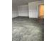 Unfinished garage with sealed concrete floors and access door, ready for customization at 1202 Brightwood Cir, Greenfield, IN 46140