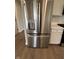 Stainless steel French door refrigerator stands elegantly near the gas range at 1202 Brightwood Cir, Greenfield, IN 46140