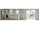 Open kitchen with modern appliances, a central island, and sliding door to backyard at 1202 Brightwood Cir, Greenfield, IN 46140
