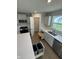 Bright kitchen features stainless steel appliances, a pantry and convenient pull-out trash can at 1202 Brightwood Cir, Greenfield, IN 46140