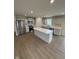 Well-equipped kitchen featuring stainless steel appliances and a stylish center island with seating at 1202 Brightwood Cir, Greenfield, IN 46140