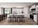 A modern kitchen with a large island, stainless steel appliances, and hardwood floors at 1202 Brightwood Cir, Greenfield, IN 46140