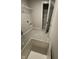 Bright laundry area with open shelving and a convenient wash basin for added functionality at 1202 Brightwood Cir, Greenfield, IN 46140