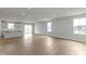 Open-concept living area with natural light, featuring hardwood floors and neutral paint scheme at 1202 Brightwood Cir, Greenfield, IN 46140