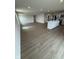 Inviting living space with hardwood floors, recessed lighting, and a view of the kitchen island at 1202 Brightwood Cir, Greenfield, IN 46140