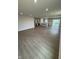 Spacious open-concept living area with hardwood floors, recessed lighting, and a view of the kitchen at 1202 Brightwood Cir, Greenfield, IN 46140