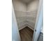Walk-in pantry with ample shelving provides lots of storage in the kitchen at 1202 Brightwood Cir, Greenfield, IN 46140