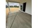 Spacious concrete patio, perfect for outdoor entertaining, overlooks the newly seeded yard at 1202 Brightwood Cir, Greenfield, IN 46140