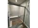 Modern walk-in shower with glass door and built-in bench at 1202 Brightwood Cir, Greenfield, IN 46140