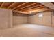 Expansive unfinished basement featuring concrete walls and floor, with utility access and small window at 14461 Brook Meadow Dr, McCordsville, IN 46055