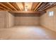 Unfinished basement with concrete floor and walls, featuring exposed beams and utilities at 14461 Brook Meadow Dr, McCordsville, IN 46055