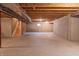 Large unfinished basement with concrete floors and walls, stairs, and small window at 14461 Brook Meadow Dr, McCordsville, IN 46055