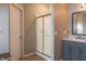 Bathroom showcasing a glass-enclosed shower, modern vanity, and neutral color scheme at 14461 Brook Meadow Dr, McCordsville, IN 46055